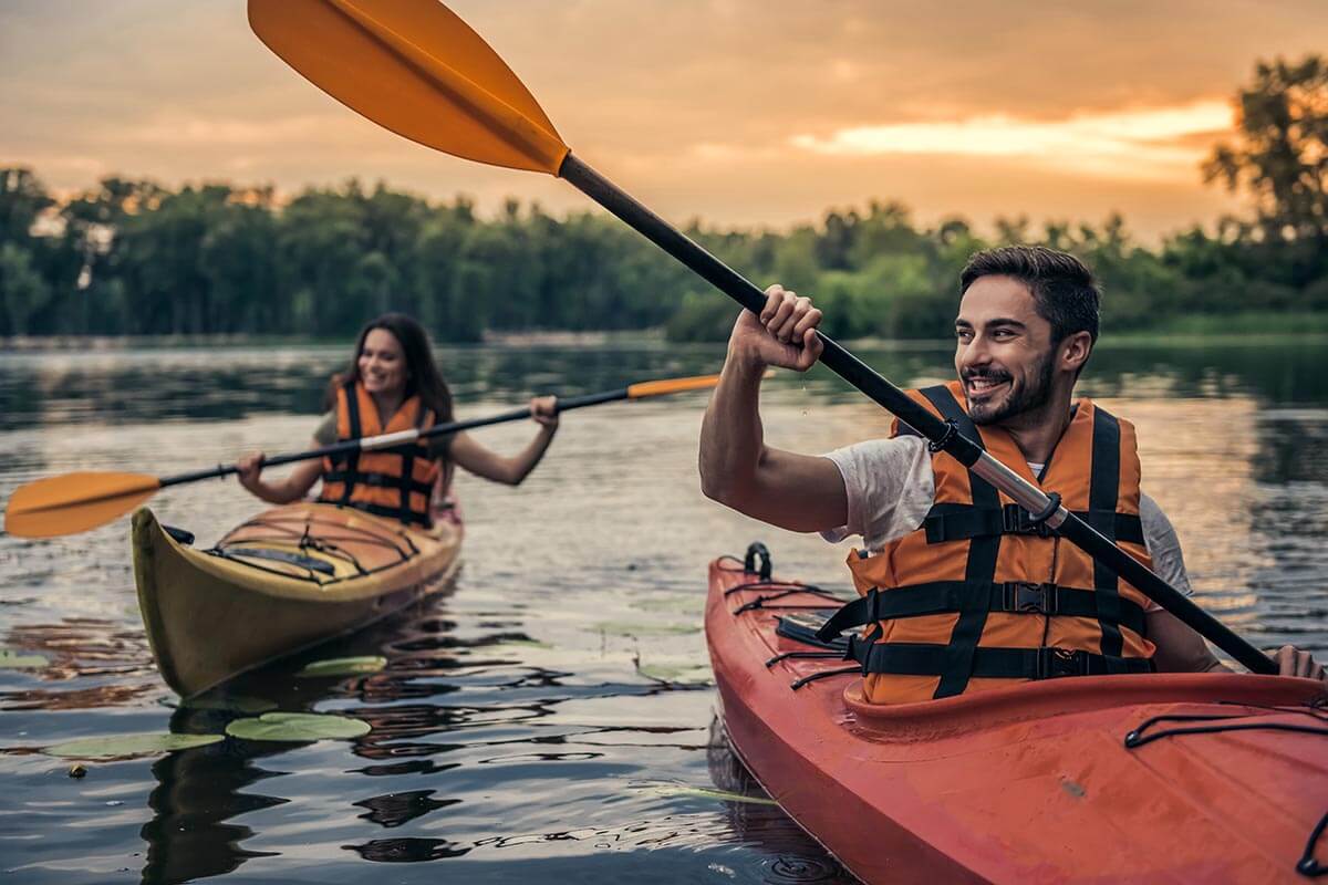 Woman and Man Kayaking Together