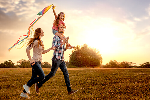 Happy Family Playing Outside