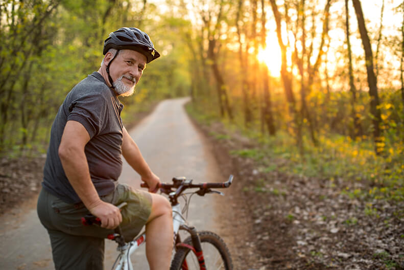 Man on a Bike in the Woods